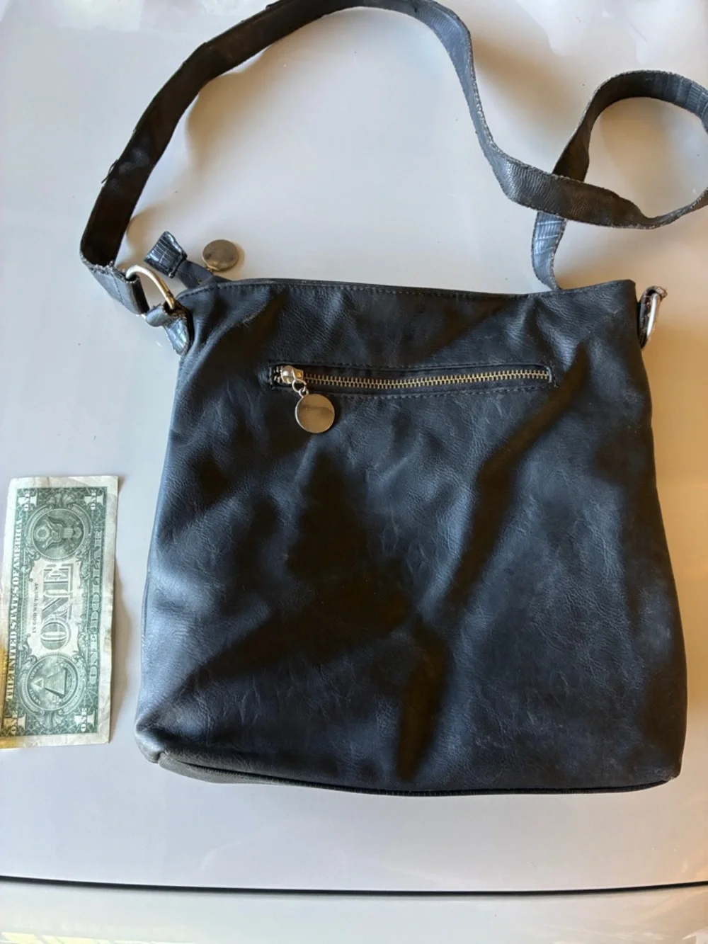 Black Crossbody Leather Bag with Religious Print on outside and floral print in